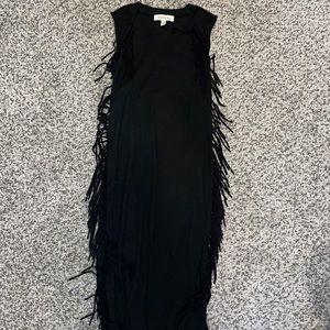 Black ribbed dress with tassels along the sides